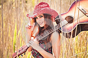 Romantic girl and guitar. Hippie style.