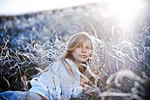 Romantic girl lying in grass