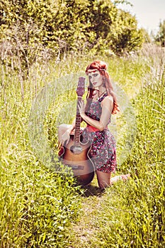 Romantic girl travelling with her guitar, summer, retro style