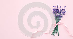 Romantic greeting card with bouquet of lavender flowers on cream paper background. Template with empty place for text. Mockup,