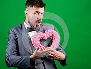 Romantic greeting. stylish esthete with decorative heart. Love. Wedding day. Valentines day holiday. bearded man in