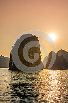 Romantic Halong bay sunset over limestone rocks, Vietnam