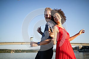 Romantic happy couples dancing and drinking at party