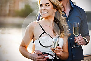 Romantic happy couples dancing and drinking at party