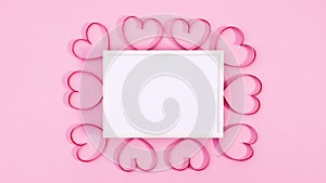 Romantic hearts for Valentine`s day appear under frame for text. Stop motion