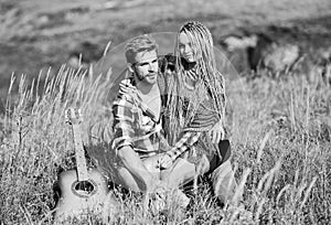 Romantic hike. Family hike. Boyfriend and girlfriend with guitar in mountains. Enjoying each other. Summer hike