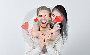 Romantic ideas celebrate valentines day. Man and woman couple in love hug and hold red heart valentines cards close up