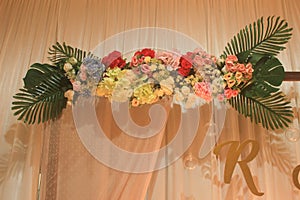 Romantic indoor decoration with fresh flowers for weddings, fiancÃ©s, ceremonies