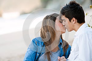 Romantic kiss on beach.