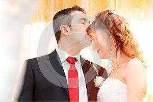 Romantic kiss of newlyweds