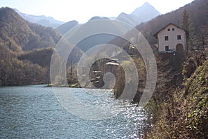 The romantic lake of Isola Santa in Tuscany, in the mountains of the Apuan Alps. panorama out of focus with a bit of mist