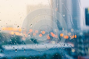 Romantic and lonesome mood near glass window in raining