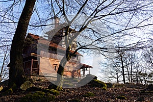 Romantic lookout tower Vlkova in beautiful magic spring forest, Czech Republic, sunny day, clear blue sky