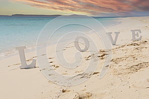 Romantic love sign on a tropical beach paradise