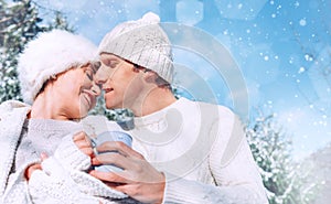 Romantic in love tender kissing couple winter portrait in the sn