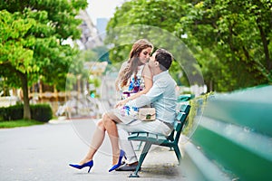 Romantic loving couple having a date near the Eiffel tower