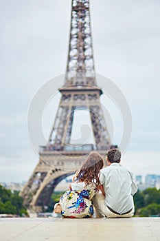 Romantic loving couple having a date near the Eiffel tower