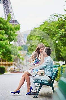 Romantic loving couple having a date near the Eiffel tower