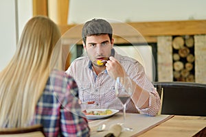 Romantic lunch in a fancy restaurant.couple sitting and eating at lunch time