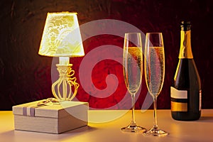 Romantic luxury evening with champagne and gift.