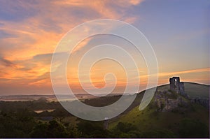 Romantic magical castle ruins against sunrise