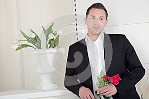 Romantic man with a red rose