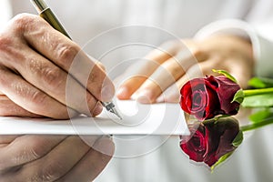 Romantic man writing a love letter photo