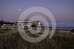 The romantic Marienlyst beach hotel with ryegrass in the foreground