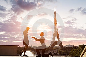 Romantic marriage proposal at Eiffel Tower, Paris, France