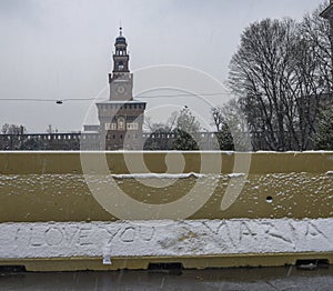 Romantic message written, I love you Maria, written on snow with Castello Sforzesco on the background, winter concept