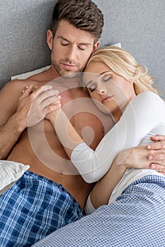 Romantic Middle Age Couple Sleeping on Bed