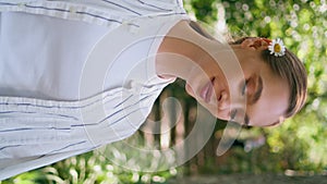 Romantic model walking green park close up. Woman strolling forest vertically