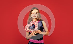 Romantic mood. Happy child hold heart red background. Holiday of love and care. Little girl with pink heart. Heart