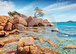 Romantic morning scene of popular touris deastination - Capriccioli beach. Sunny public beach with sand & granite rocks nestled in photo