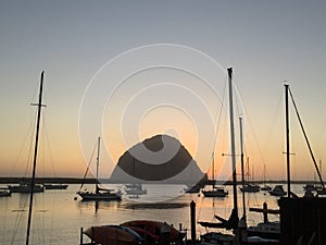 Romantic morro bay harbor sunset with morro rock