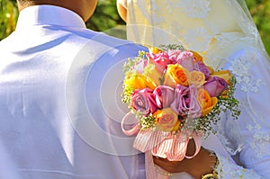 Malay Couple hold Wedding Flower Bouquet