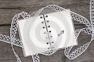 Romantic notebook and white lace