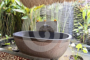 Romantic outdoor stone bathroom in island Bali, Indonesia