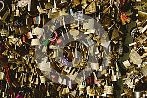 Romantic padlocks placed on bridges by couples of lovers in love who chain their destinies