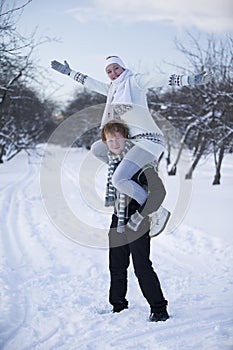 Romantic photo of cute couple outdoors in winter. Young man and