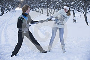 Romantic photo of cute couple outdoors in winter. Young man and