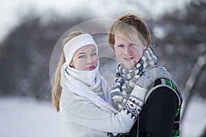 Romantic photo of cute couple outdoors in winter. Young man and