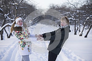 Romantic photo of cute couple outdoors in winter. Young man and