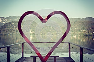 Romantic photo zone for wedding or love story in the shape of a heart on alpine lake Bled, Slovenia