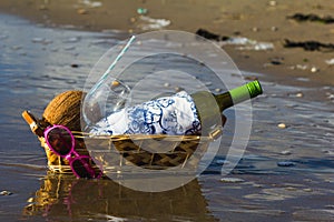 Romantic picnic in the evening. Beach picnic basket at sunset