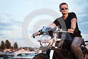 Romantic portrait handsome biker man in sunglasses