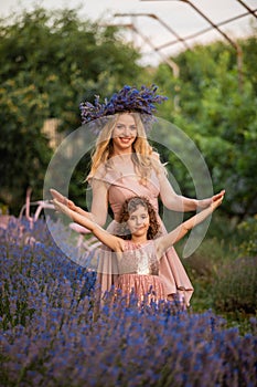 Romantic portrait o charming girl in straw hat in lavender