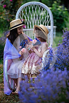 Romantic portrait o charming sisters in straw hats