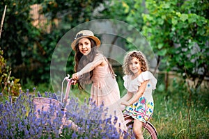 Romantic portrait o charming sisters in straw hats