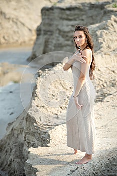 Romantic portrait of a young girl in a stylish linen dress